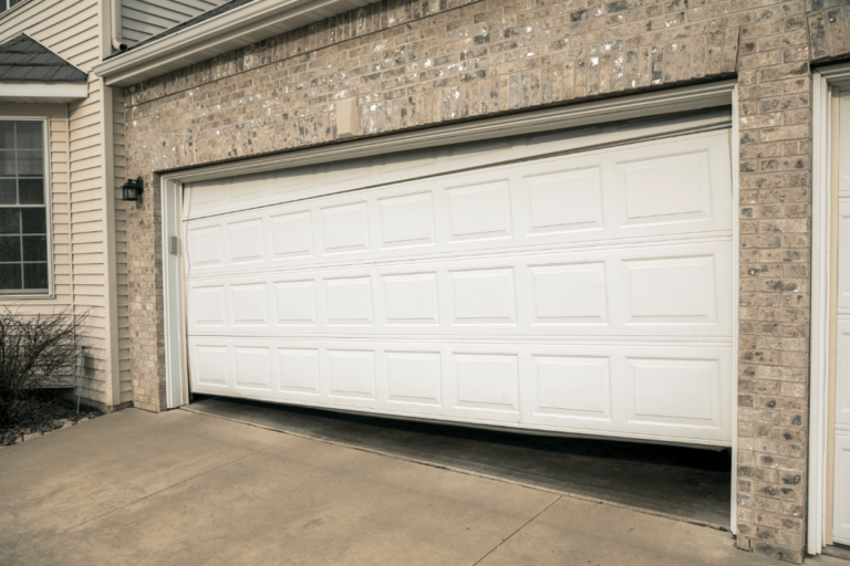 garage door won't close all the way and goes back up